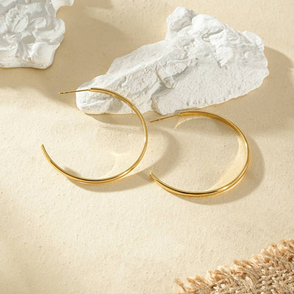 Öppna runda creoler i guld