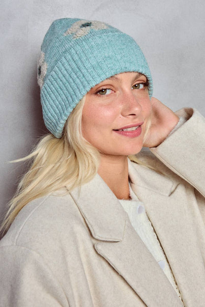 Blommig mössa i ull: Ljusblå - 20% Ull