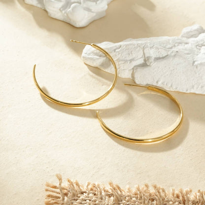 Öppna runda creoler i guld