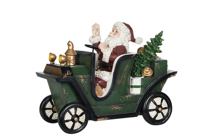 Jultomte på väg med sin bil lastad med klappar för stora och små.  Storlek: 25 x 12 x 19 cm  Material: Poly